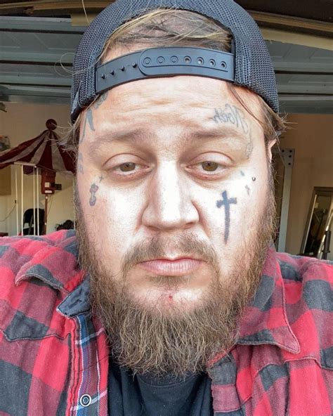 fat singer with tattoos on face